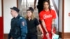 WNBA star and two-time Olympic gold medalist Brittney Griner is escorted to a courtroom for a hearing, in Khimki just outside Moscow, Russia, July 7, 2022. 