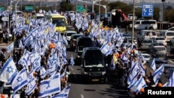 Israelis gather to bid farewell to Shiri, Ariel and Kfir Bibas, in Ashkelon