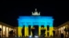 The Brandenburg Gate in Berlin, Germany, is illuminated in the colors of the Ukrainian flag to show solidarity with the country as Russia launches a military operation, Feb. 23, 2022.